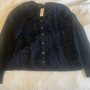 Navy and black sleeves and back are black front is navy lace